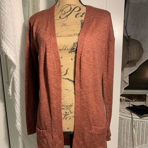 Thigh length sweater with pockets